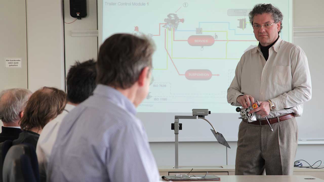 Instructor presents trailer control module to seated trainees